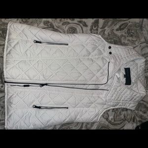 Size small white vest, never worn